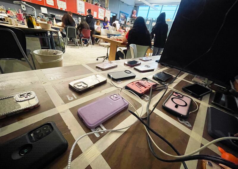 Student cell phones are placed in assigned spots near the entrance to Bradley-Bourbonnais Community High School art teacher Tori Cohagan's class, where students surrender their phones to focus on their work, in this Oct. 2024 file photo.