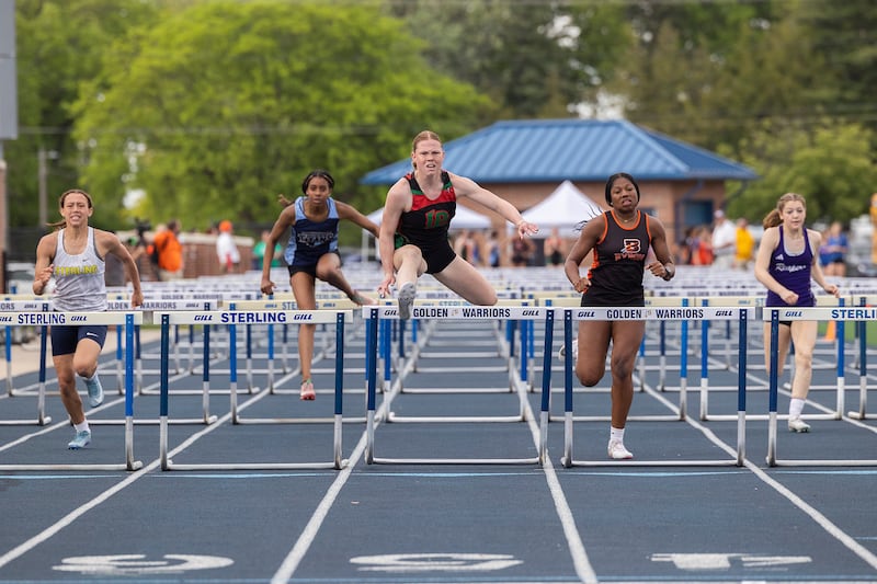 Byron's Malia Morton (right) chases LaSalle-Peru's Elli Sines (15.50) in the 100 hurdles Wednesday, May 14, 2025 at the 2A Sterling Sectional. Morton finished second in 15.64 and qualified for this week's state finals at Eastern Illinois University in Charleston.