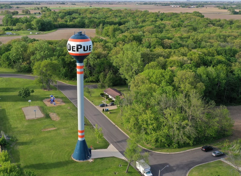 An aerial view of the DePue water tower on Monday, May 11, 2026 in DePue. On Sunday, officers responded to a call of a domestic disturbance in the 2770 block of East Street, while Illinois State Troopers assisted with providing perimeter security. ​Officers were advised the subject was armed and holding several people hostage, including juveniles. ​ On scene, officers entered the residence and shots were subsequently fired. The subject and one juvenile were struck by gunfire. ISP officers entered the residence after shots were fired to assist with providing medical aid and transported the juvenile to a local hospital, where they were pronounced deceased. The subject was taken to a local hospital with gunshot wounds.