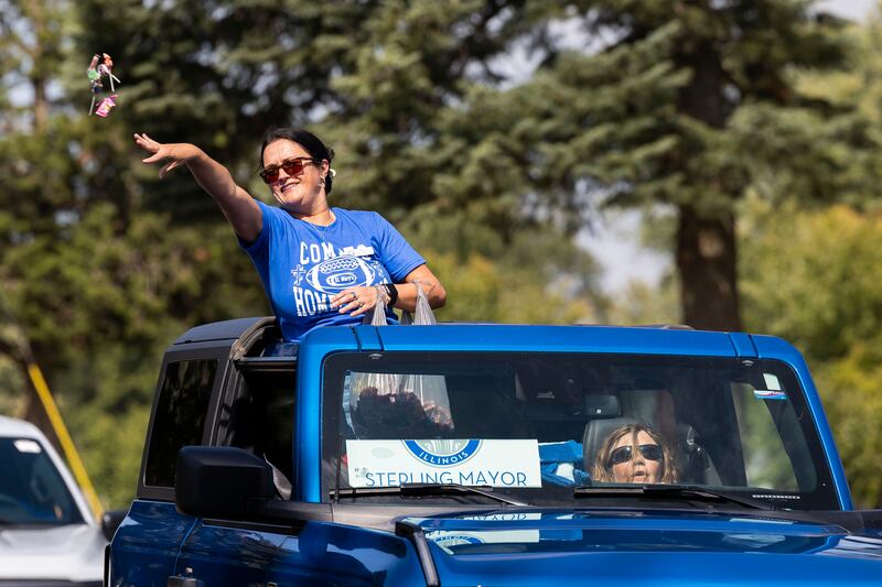 Sterling mayor Diana Merdian throws candy Friday, Sept. 12, 2025, while celebrating Newman High School’s homecoming parade.
