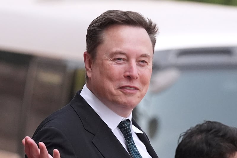 FILE - Elon Musk departs after a welcome ceremony with President Donald Trump and China's President Xi Jinping at the Great Hall of the People, Thursday, May 14, 2026, in Beijing.
