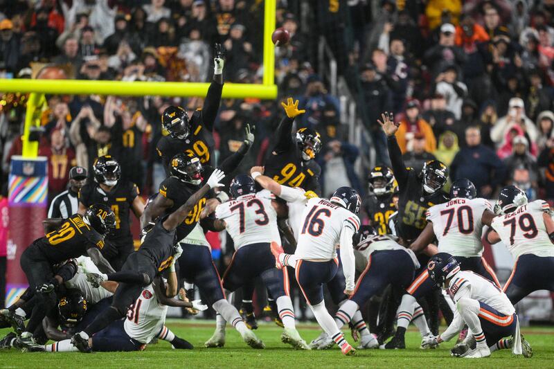 Chicago Bears kicker Jake Moody (16) kicks the game-winning field goal as time expires in an NFL football game against the Washington Commanders, Monday, Oct. 13, 2025, in Landover, Md. (AP Photo/Nick Wass)