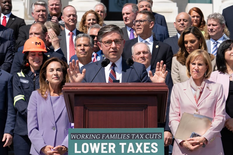 Speaker of the House Mike Johnson, R-La., and fellow Republicans celebrate GOP tax policies at an event outside the Capitol in Washington, Wednesday, April 15, 2026. (AP Photo/J. Scott Applewhite)