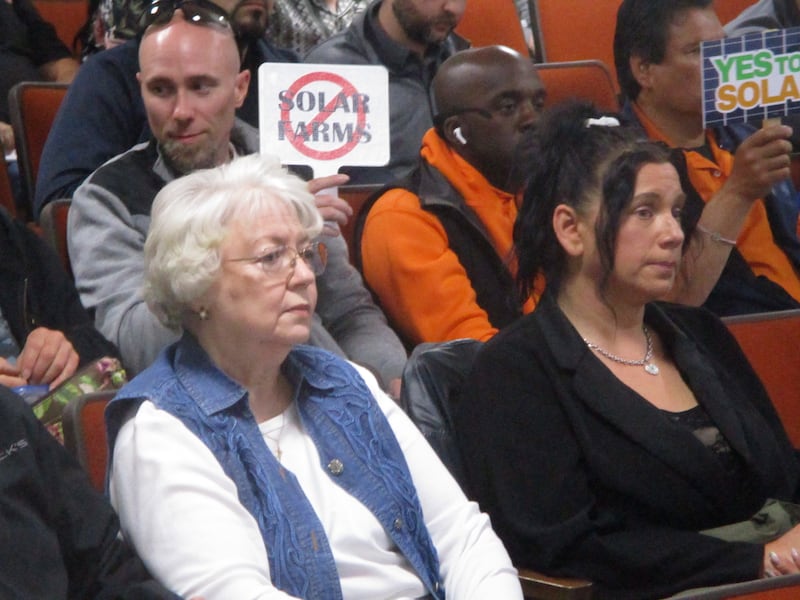 Farm owner Ruby Roemer (left) of Green Garden Township sits down after speaking out in support of having the option to lease her land for solar energy at the Will County Board meeting Thursday in the Will County Office Building in Joliet. May 21, 2026