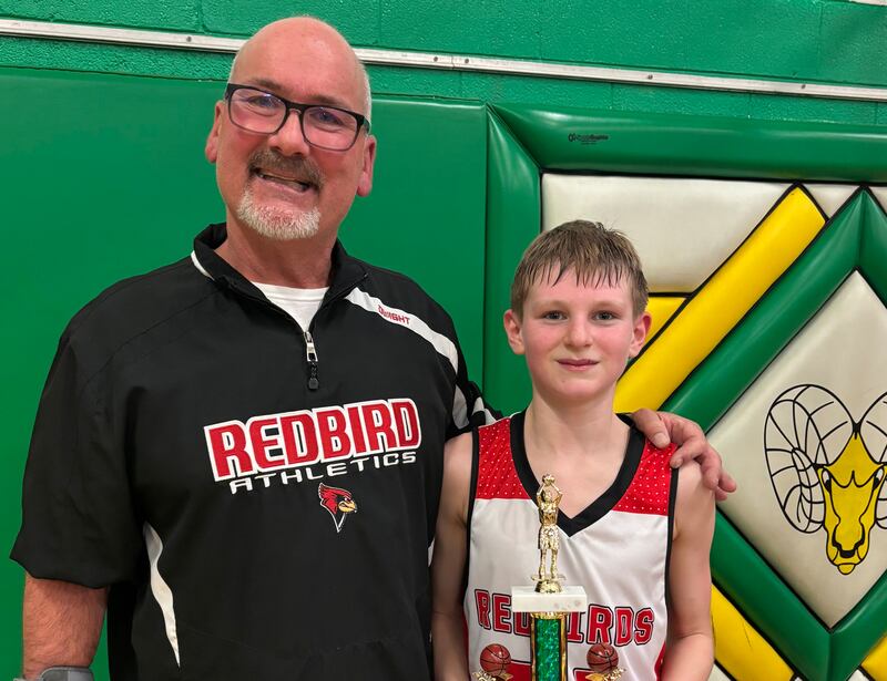 Stinnett Gettinger celebrating a victory with one of his track runners at Dwight Elementary School.