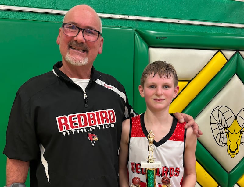 Stinnett Gettinger celebrating a victory with one of his track runners at Dwight Elementary School.