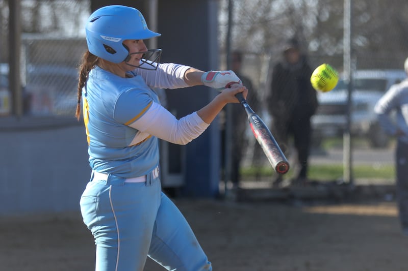 Joliet Catholic's Addison Rizzatto (8) swings at a pitch during softball game between Minooka at Joliet Catholic on Tuesday, April 8, 2025 in Joliet.