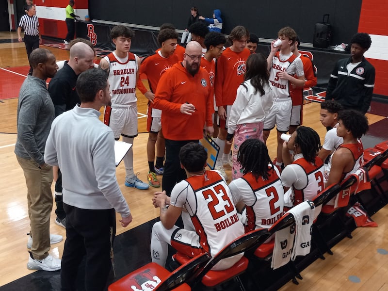 Bradley-Bourbonnais head coach Eric Long addresses his team during a fourth-quarter timeout in a 56-41 home loss to Don Bosco Prep on Dec. 12, 2025.