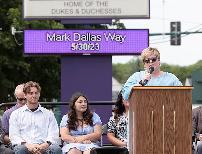 Dixon schools Superintendent Margo Empen speaks to the crowd during a ceremony naming the road in front of Dixon High School as “Mark Dallas Way” on Tuesday, May 30, 2023.