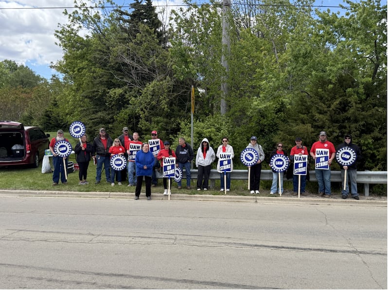 Workers with UAW 904 picket outside HCC Inc. on Wednesday, May 13, 2026 following unsuccessful negotiations on a new four-year agreement with the union and the agricultural harvesting equipment company.