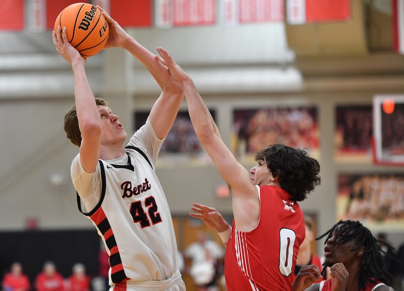 Benet’s Colin Stack shoots over Marist’s Adoni Vassilakis (0) during a game on Friday, Dec. 13, 2024 at Benet Academy in Lisle.