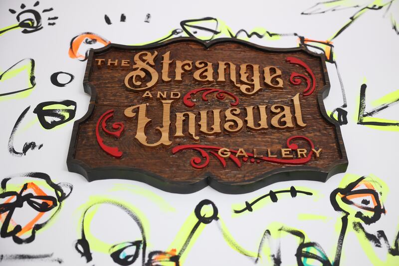 Christine Nordstrom leaves remnants of past shows, like the drawing around the store sign, at her gallery Strange and Unusual Gallery in Downtown Joliet on Friday, May 26, 2023.