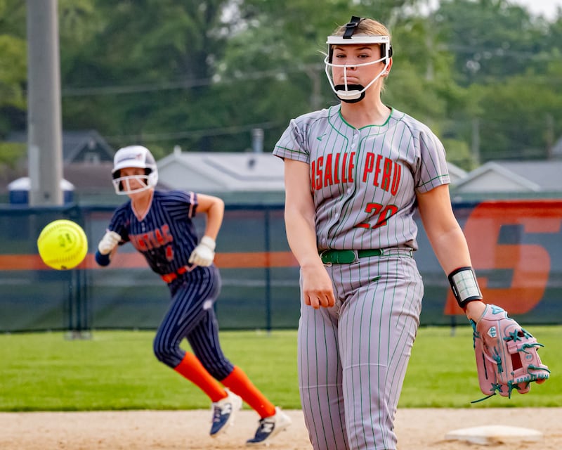 Taylor Vescogni of LaSalle Peru High School throws a pitch as a Plano athlete leads off second base during the Illinois Class 3A regional game on May 30, 2025 at Pontiac High School.