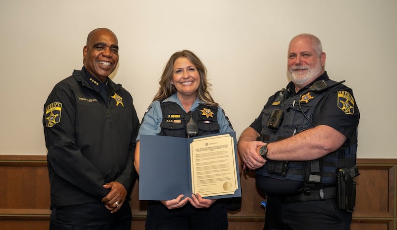 Sheriff John D. Idleburg (from left), Auxiliary Sgt. Stacey Rowan, Sgt. James Yanecek (unit commander)