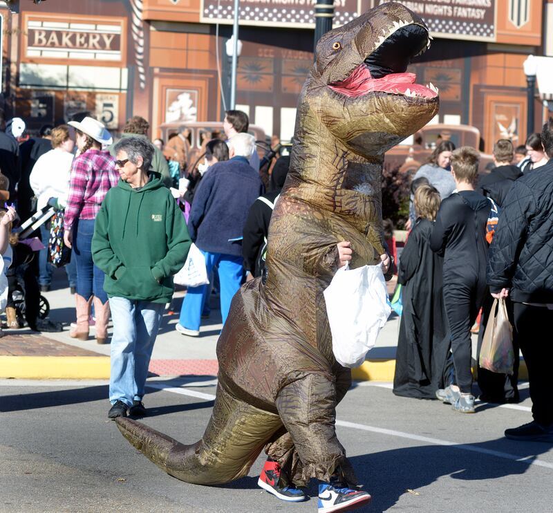 Dinosaurs were part of the action Saturday, Oct. 26, 2024, in downtown Streator during the annual downtown trick or treat.