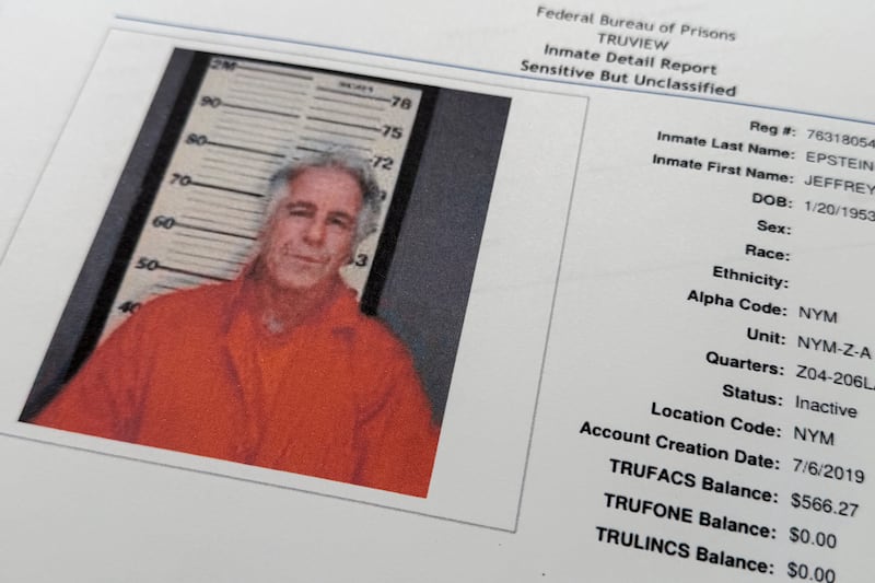 A document that was included in the U.S. Department of Justice release of the Jeffrey Epstein files, photographed Tuesday, Feb. 10, 2026, shows a photo of Epstein on a inmate report from the Federal Bureau of Prisons . (AP Photo/Jon Elswick)