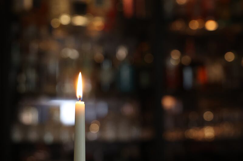 A candle burns at the quaint bar inside Tallgrass restaurant in downtown Lockport on Friday, Jan 24, 2025.