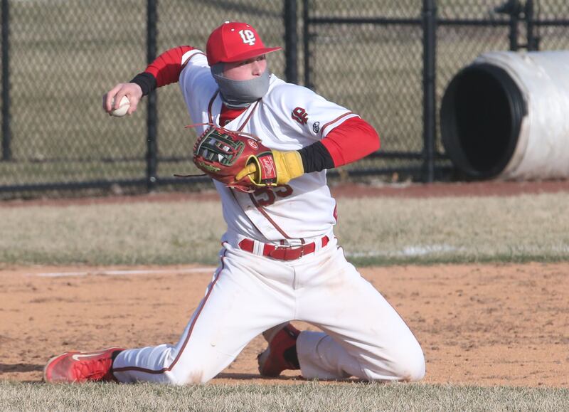 L-P's Jacob Gross throws to second base after making a leaping catch against Pontiac on Monday, March 24, 2025 at Huby Sarver Field inside the L-P Athletic Complex in La Salle.
