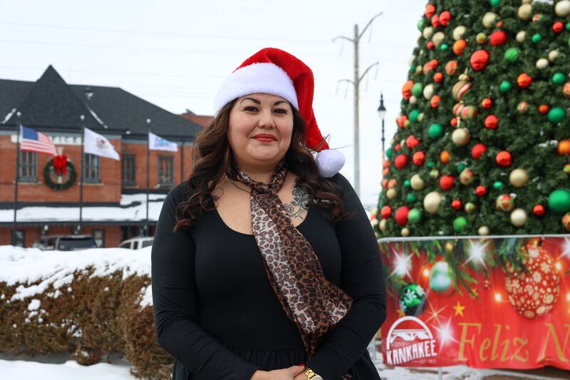 Monica Pizano, who will serve as the 2025 Kankakee Christmas Parade grand marshal, stands for a portrait on Dec. 5, 2025, in downtown Kankakee. Pizano was the first Hispanic to own a real estate firm in Kankakee County when she opened her downtown RE/MAX Prestige Homes office in 2022, and will now be the first Latino marshal in the parade's history.