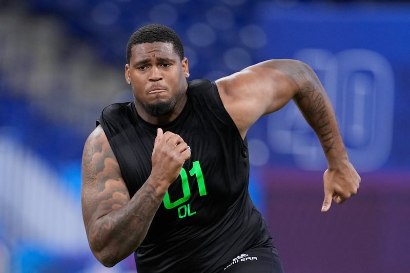 Texas offensive lineman Kelvin Banks Jr. runs a drill at the NFL football scouting combine in Indianapolis, Sunday, March 2, 2025. (AP Photo/George Walker IV)