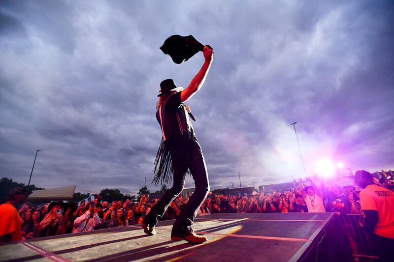 Big Kenny greets the crowd as Big & Rich take the stage at the Bradley 315 Music Fest held at Northfield Square mall on June 8.