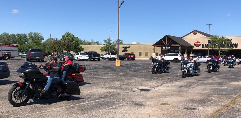 Participants in "The Wall that Heals" processional depart the Woodstock Harley Davidson May 22, 2024.