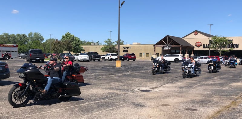 Participants in "The Wall that Heals" processional depart the Woodstock Harley Davidson May 22, 2024.