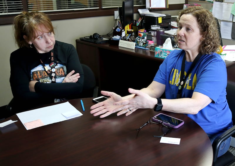 Tracy Beling, (right) a reading specialist at Lincoln Elementary School, talks as Christal Egel, a media center assistant, looks on Friday, March 21, 2025, at the school in DeKalb, about their experience at a winter educators conference in Alaska where they learned about the Iditarod dog sled race held annually there. The two educators were able to bring back what they learned to set up curriculum related to the race.