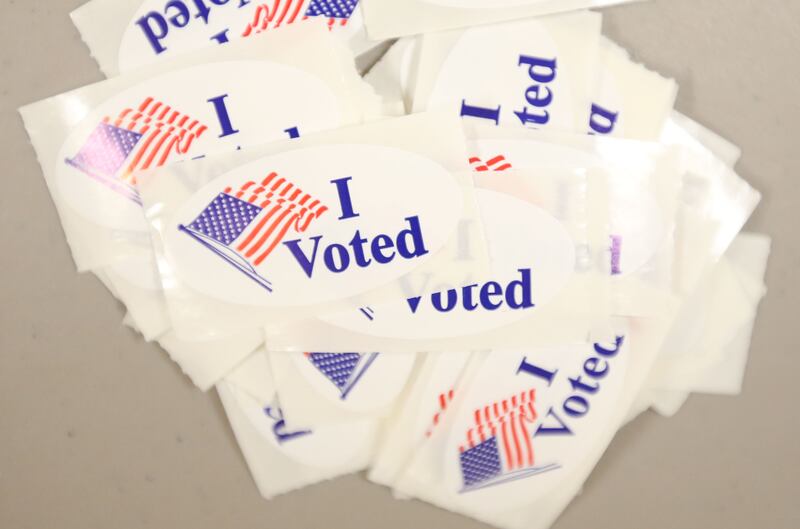 A pile of "I voted" stickers lay on a table near the ballot machine on Tuesday, April 1, 2025 at the Oglesby Elks.