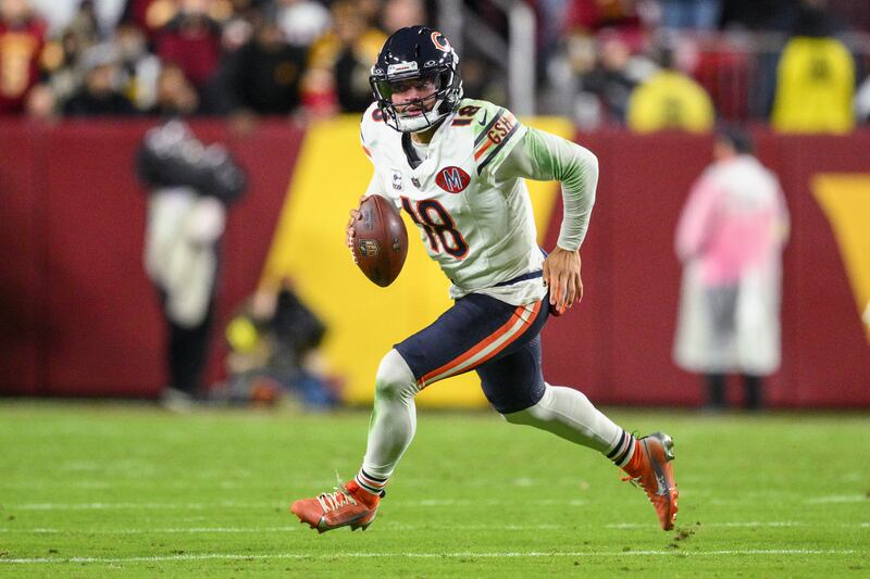 Chicago Bears quarterback Caleb Williams runs with the ball during the first half of an NFL football game against the Washington Commanders, Monday, Oct. 13, 2025, in Landover, Md. (AP Photo/Nick Wass)