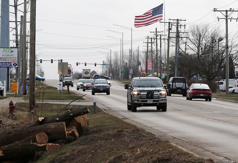Logs are piled alongside Route 47 on Wednesday, Dec. 11, 2024, in Woodstock as tree removal continues in preparation for the Route 47 construction project.