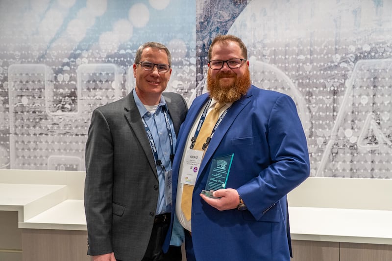 Gurnee Park District Executive Director Mike Szpylman stands with Kraig Owens, director of parks and planning, who was awarded the Jim Berousek Distinguished Alumnus Award from Western Illinois University.