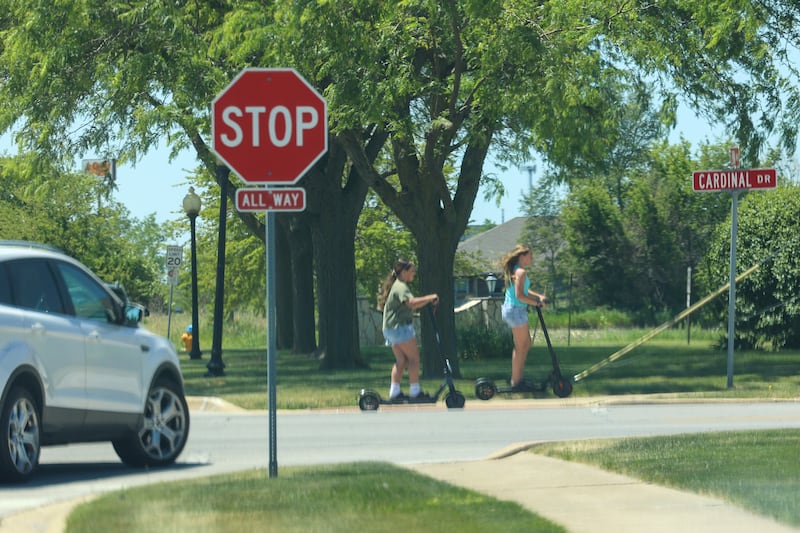 Two children drive motorized scooters in Bradley on Tuesday, June 2, 2026. Local municipalities have seen an increased presence of the electric scooters and bikes driven by young residents, causing concern for safety.