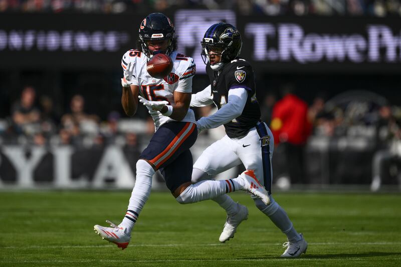 Chicago Bears wide receiver Rome Odunze (15), left, makes a catch against Baltimore Ravens cornerback Marlon Humphrey (44) during the first half an NFL football game, Sunday, Oct. 26, 2025, in Baltimore. (AP Photo/Nick Wass)