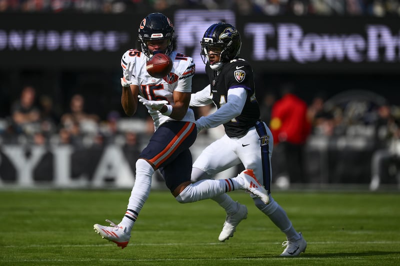 Chicago Bears wide receiver Rome Odunze (15), left, makes a catch against Baltimore Ravens cornerback Marlon Humphrey (44) during the first half an NFL football game, Sunday, Oct. 26, 2025, in Baltimore. (AP Photo/Nick Wass)