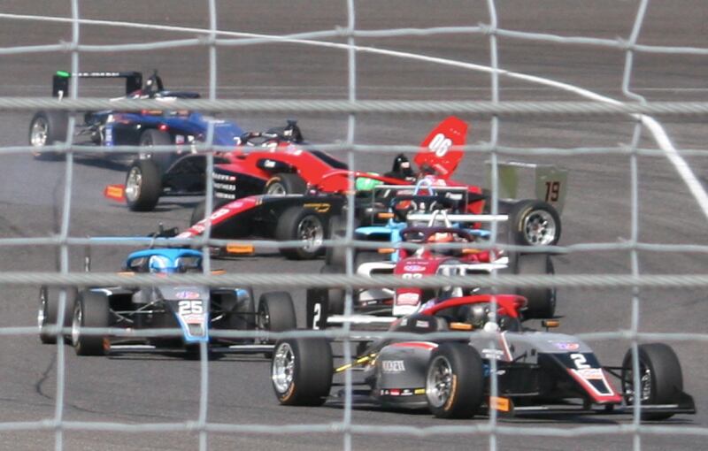 Evan Cooley (90) loses control and spins in Turn 1 of the Indianapolis Motor Speedway road course, hitting Christian Cameron (19) and spinning him into the grass