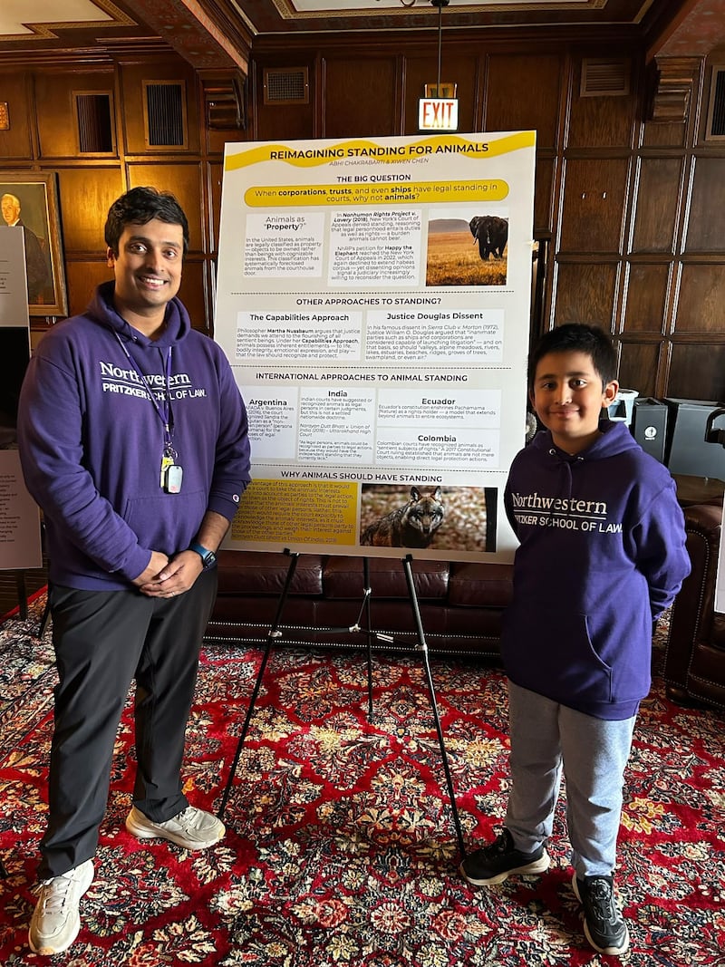 Xiwen Chen (right), who just completed fifth grade at Prairie Point Elementary School in Oswego, partnered and his father, Abhi Chakrabarti (left), to submit a poster to be considered for Northwestern’s Annual Animal Law Symposium during the 2025-26 school year.