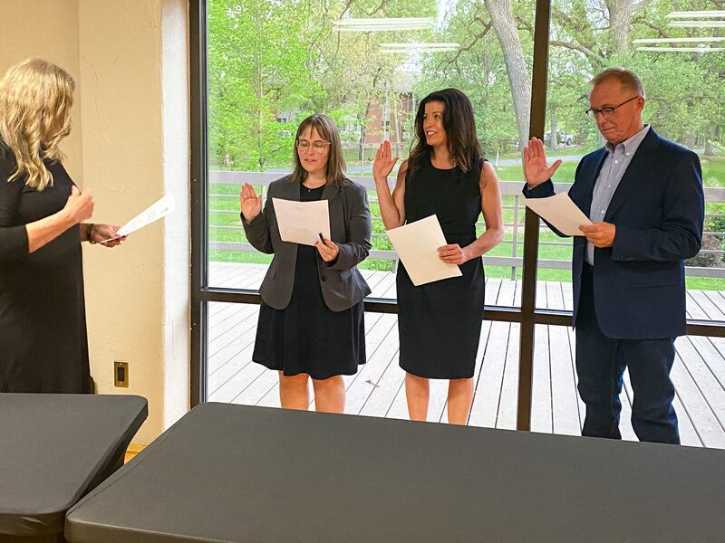 Michelle Foster, Tia Andersom and Dean Bourdages (left to right) are sworn in as commissioners at the May 15, 2025 meeting of the DeKalb Park District Board of Commissioners.