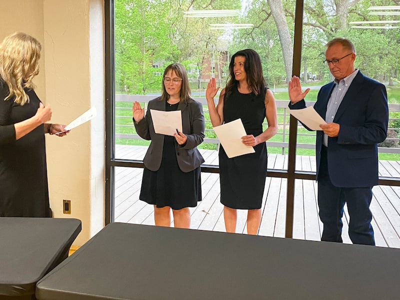Michelle Foster, Tia Andersom and Dean Bourdages (left to right) are sworn in as commissioners at the May 15, 2025 meeting of the DeKalb Park District Board of Commissioners.