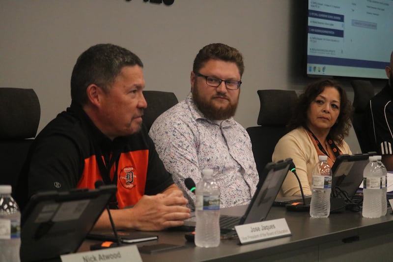 DeKalb School District 428 Board Vice President Jose Jaques speaks Tuesday, July 1, 2025, at a school board meeting, as Board President Chris Boyes (center) and Superintendent Minerva Garcia-Sanchez watch on.