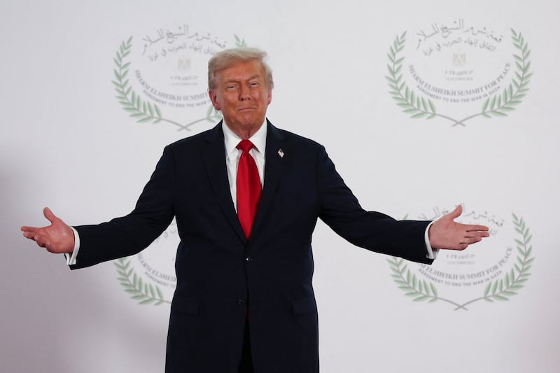 President Donald Trump waits to greet leaders during a summit to support ending the more than two-year Israel-Hamas war in Gaza after a breakthrough ceasefire deal, Monday, Oct. 13, 2025, in Sharm El Sheikh, Egypt. (Suzanne Plunkett/Pool via AP)