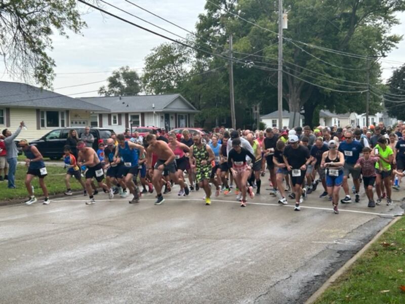 Runners take off from the starting line of the annual Harvest Hammer on Saturday in Morrison.