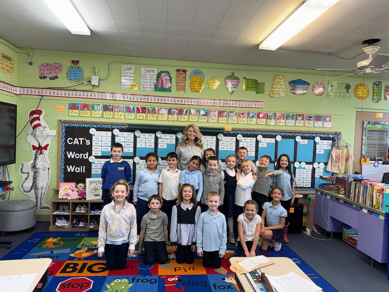 Kristen Hemmersbach with her first grade students at Immaculate Conception School on Thursday, March 20, 2025.