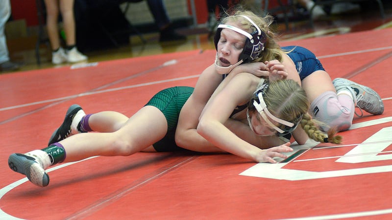 Marquette’s Lily Deibel controls her Peoria Richwoods opponent Tuesday, Dec. 30, 2025, during the semifinals of the Ottawa Holiday Hootenanny in Kingman and Love gyms.
