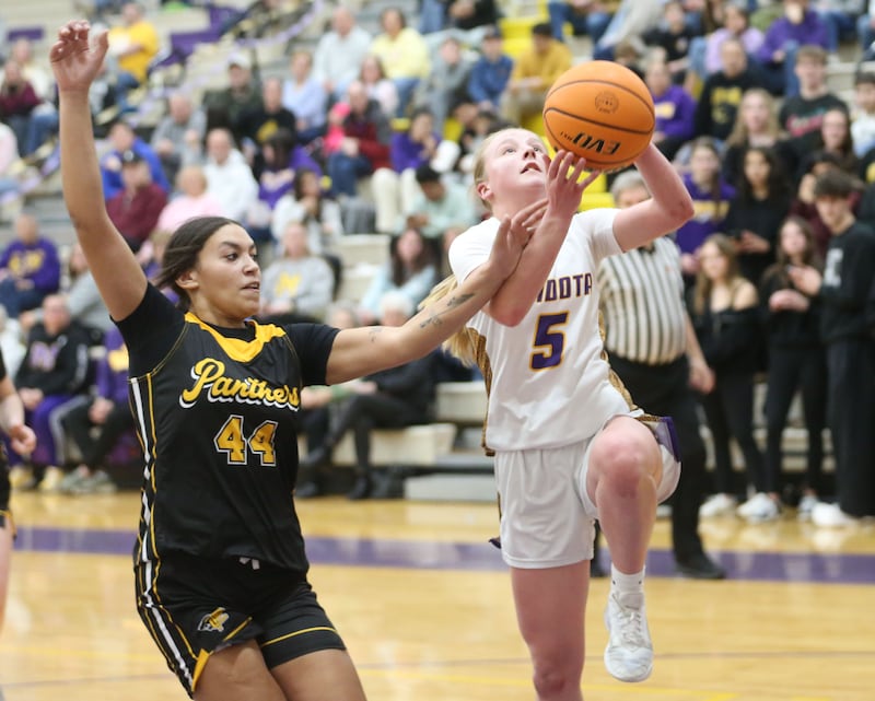 Mendota's Eva Beetz is fouled while driving to the hoop by Putnam County's Kaylynn Hill on Tuesday, Feb. 10, 2026 at Mendota High School.