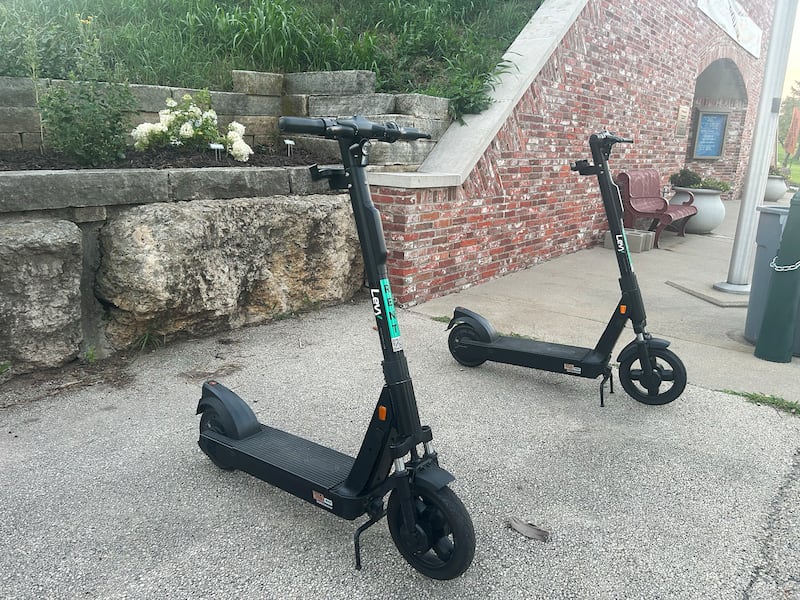 Battery operated scooters wait for rides at the base of the de Immigrant Windmill in Fulton on Friday evening, July 18, 2025.