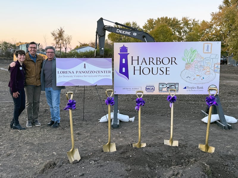 Harbor House executive director Jenny Schoenwetter, left, Alex Panozzo, center, and Tony Lott celebrate the groundbreaking of the Lorena Panozzo Center in November 2025.