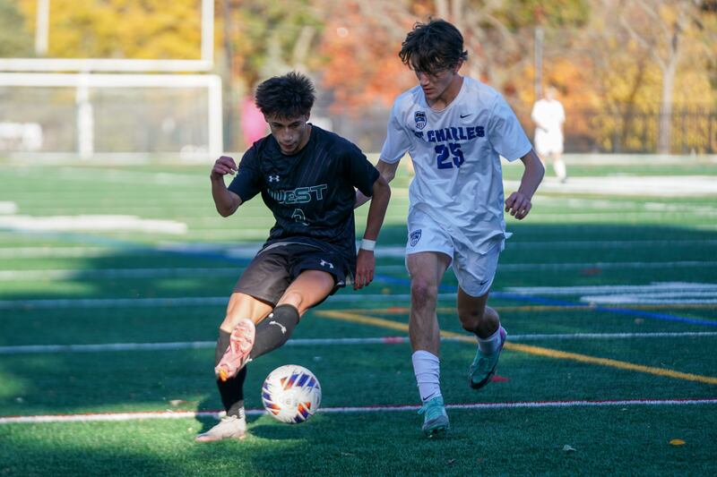Glenbard West's Alex Ginder (8) plays the ball against St. Charles North's Jack Suliman (25) during a class 3A Glenbard West Regional final soccer match at Glenbard West High School in Glen Ellyn on Saturday, Oct. 26, 2024.