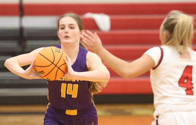 Mendota's Karson Doyle passes the ball behind Hall's Charlie Pellegrini on Monday, Dec. 1, 2025 at Hall High School.
