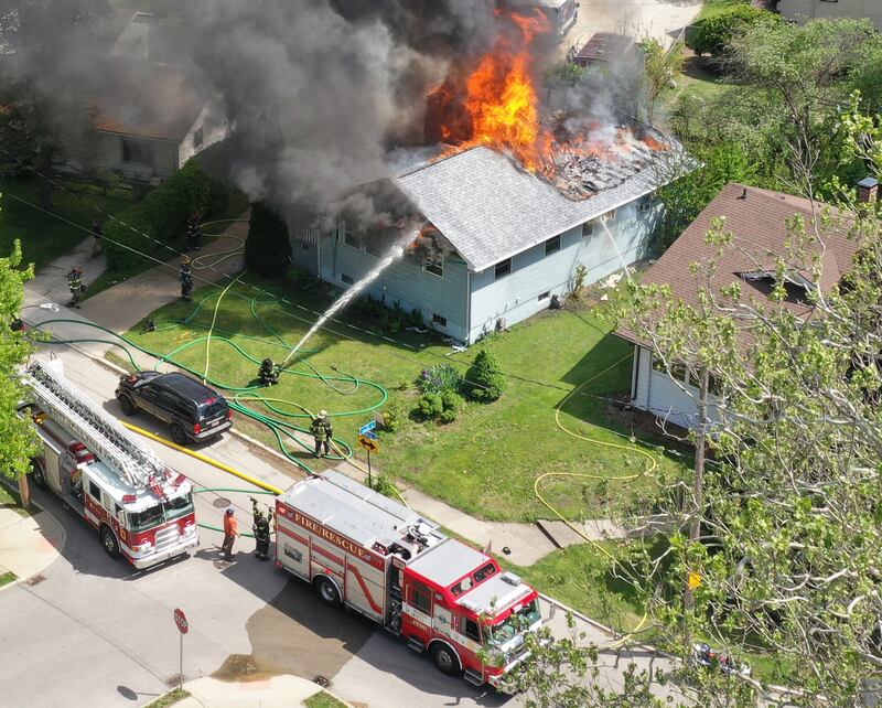 An aerial view of a structure fire as flames pour out of the roof in the 1900 block of Main Street on Monday, May 4, 2026 in Peru.
